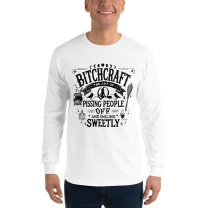 Front View: Person Wearing a White Long Sleeve Shirt With a Witchy Graphic Text: Bitchcraft: Pissing People off  and smiling Sweetly Sizes: Small to 4XL