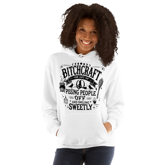 Front View: Person wearing White Hoodie with witchy text graphic Text: Bitchcraft The Art of Pissing people off and smiling sweetly Sizes: Small to 5XL