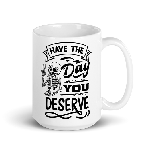 15 oz White Mug with Skeleton giving Peace Sign with Text: Have the Day You deserve