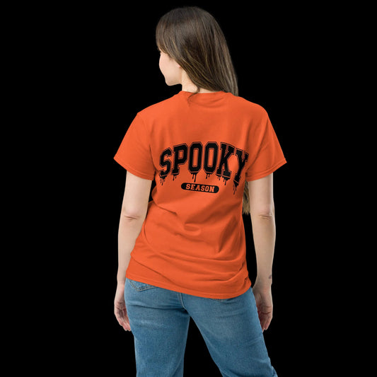 Back View: Person wearing an orange t-shirt with 'SPOOKY SEASON' text on the back Sizes: Small to 5XL
