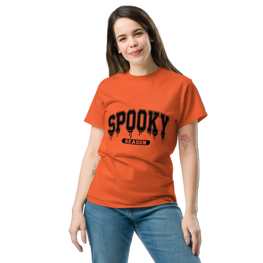 Front View: person wearing a orange shirt with black text design: SpookySeason Sizes: Small to 5XL