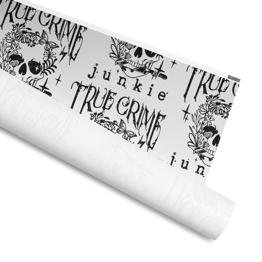 Wrapping Paper with a skull holding a knife in its teeth, decorated with Flowers and butterflies with the text: True Crime Junkie, Available in 2 sizes, 30" x 72", 30" x 180" and 2 finishes, matte and glossy 